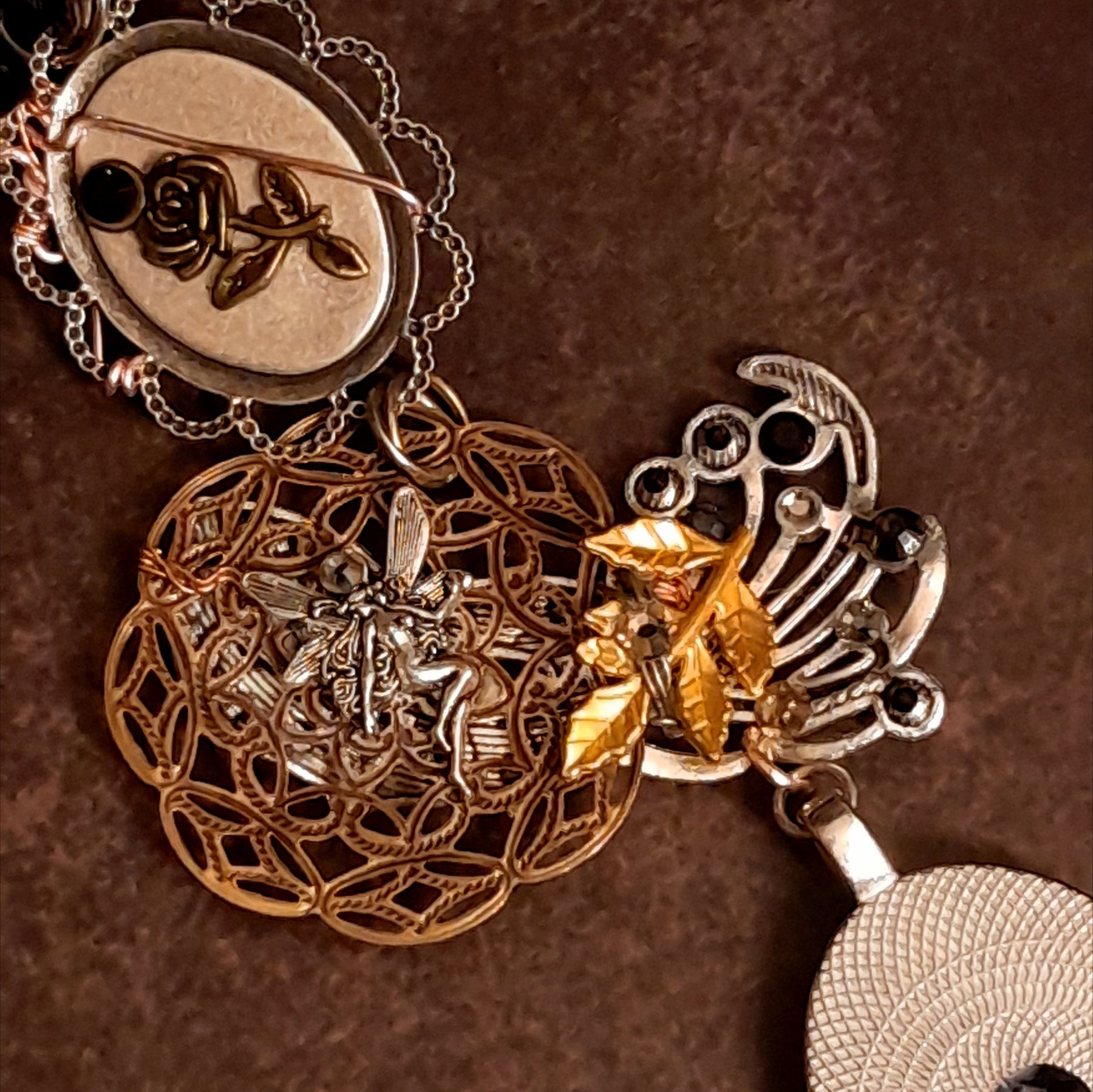 Witchy masquerade Halloween necklace showing layered charms and sculptural details, Victorian style vintage style gothic fantasy necklace