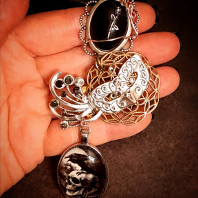 Close up on witchy masquerade Halloween necklace, Victorian style vintage style accessible jewelry clasp
