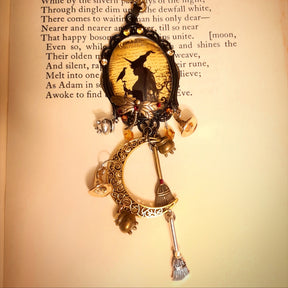 Witch and raven crescent moon necklace with layered broomstick and potion charms, sparkling Swarovski crystals, Victorian style and vintage style handmade magical fantasy jewelry by Rachel Flam Design