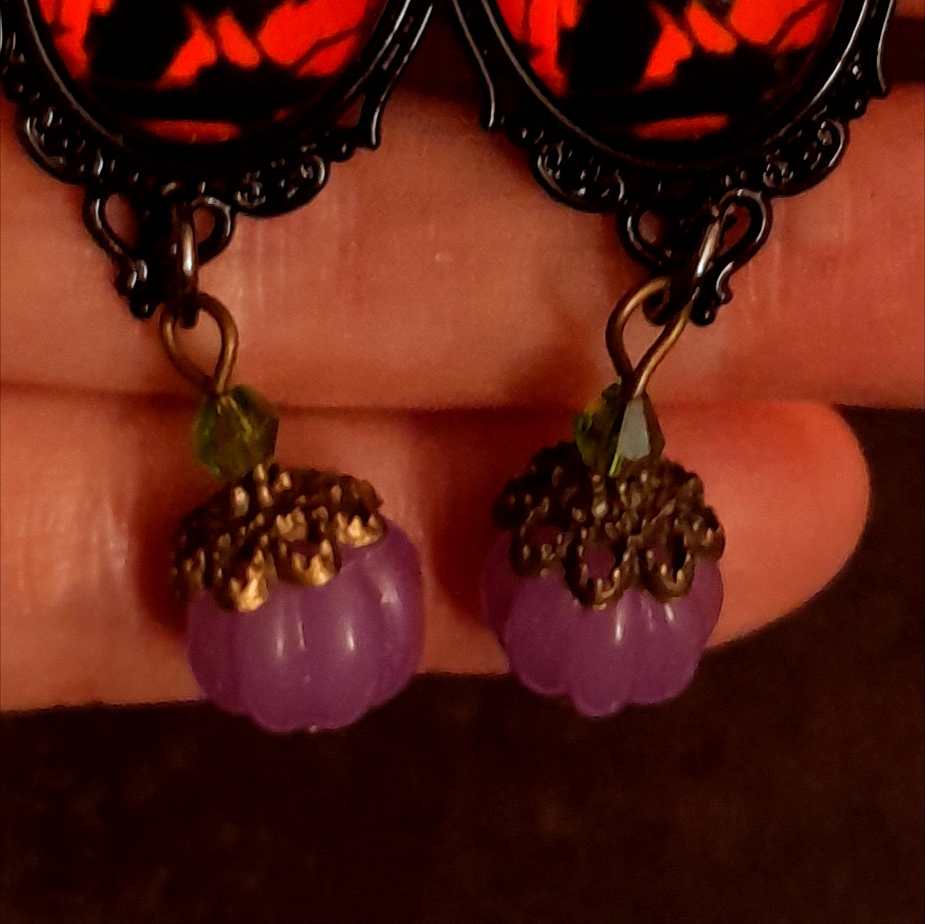 Detailed witchy dangle earrings with black crow imagery, crescent moons, purple pumpkin drops, sparkling Swarovski crystals, and hidden fairies, Victorian style and vintage style magical fantasy jewelry by Rachel Flam Design