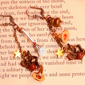 Witchy red crystal earrings featuring miniature witches, cauldrons, dangling witch hats, and sparkling Swarovski crystals, Victorian style and vintage style fantasy jewelry by Rachel Flam Design