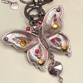 Back view of magical fantasy butterfly necklace with fairy on rainbow stone, handmade Victorian style vintage style bohemian jewelry