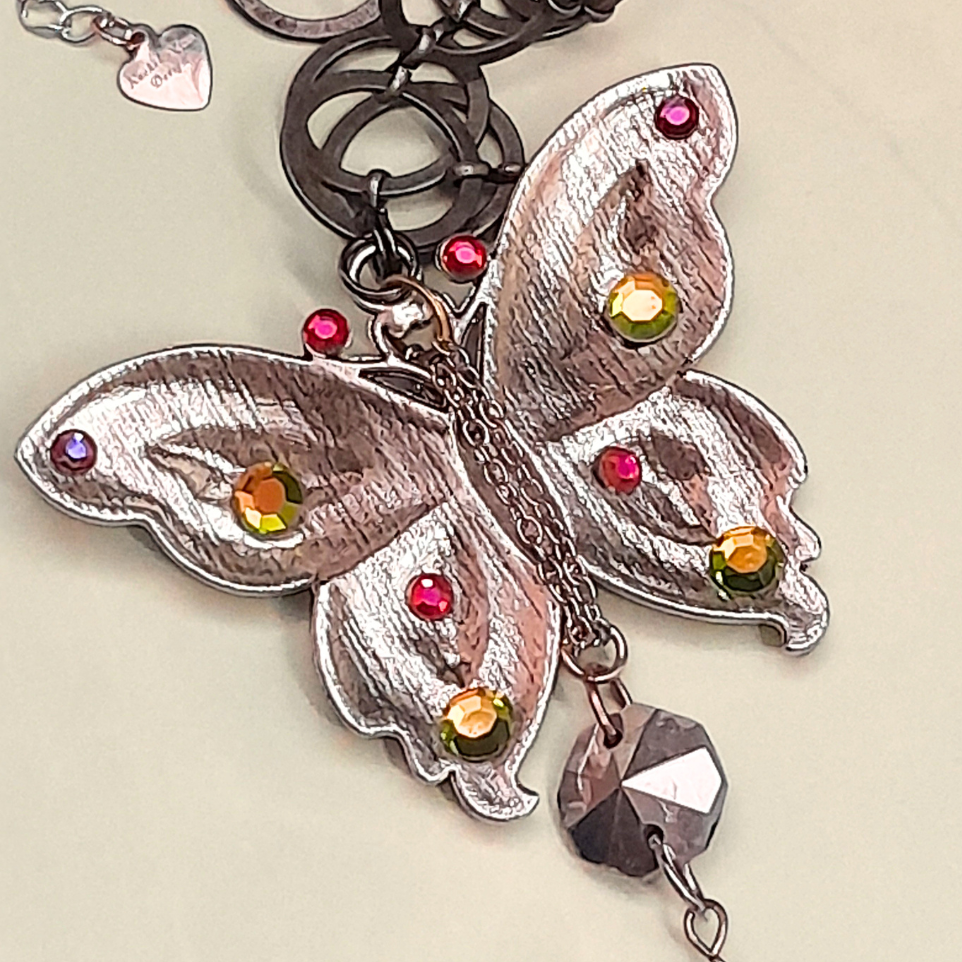 Back view of magical fantasy butterfly necklace with fairy on rainbow stone, handmade Victorian style vintage style bohemian jewelry