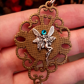 Victorian style bird necklace with tree of life cabochon, bird cage and bird, turquoise swarovski crystals silver filigree moon gold star and copper leaf. 