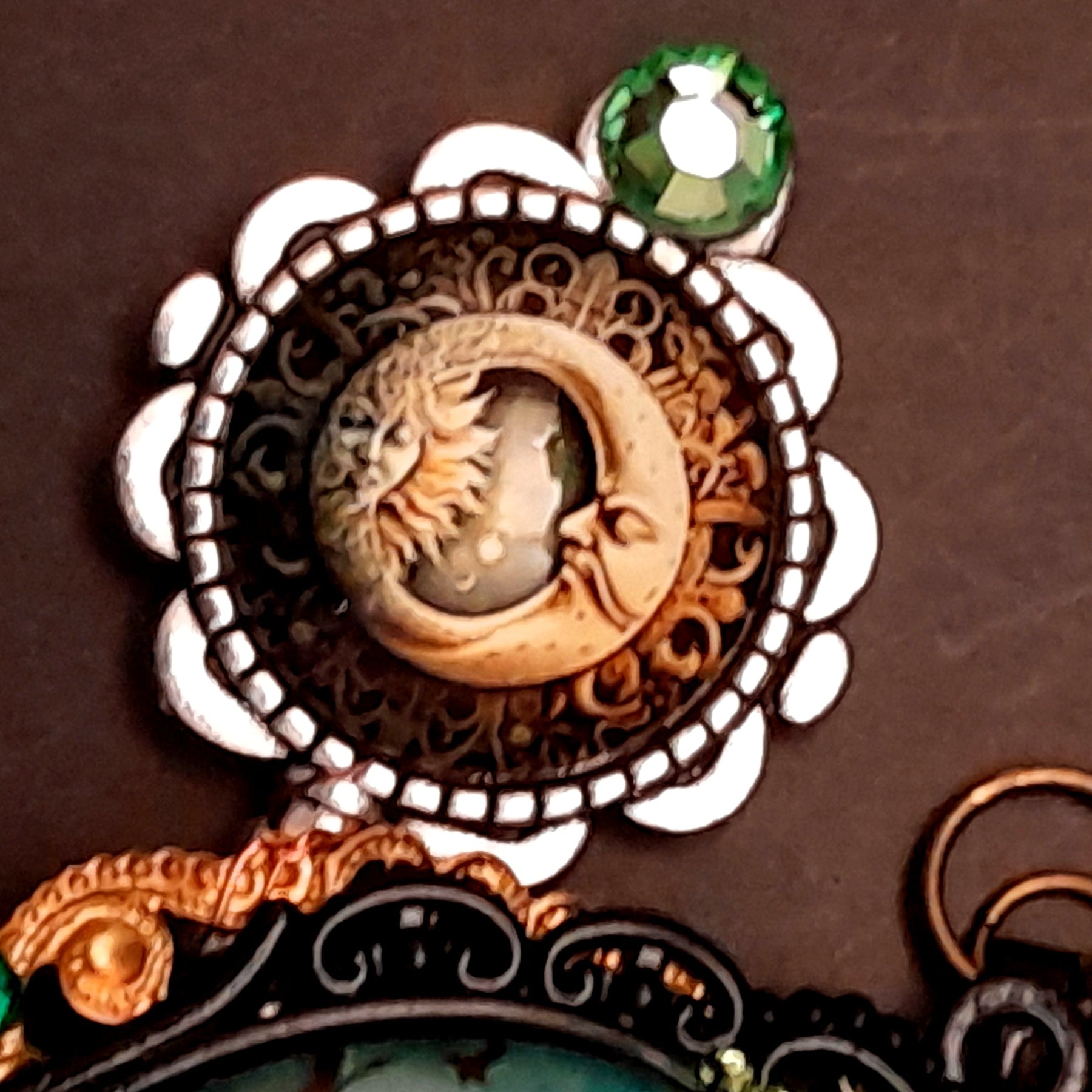 statement necklace with a black raven crow a hummingbird a dagger sun and moon bohemian cabochon on a skeleton key green swarovski crystals