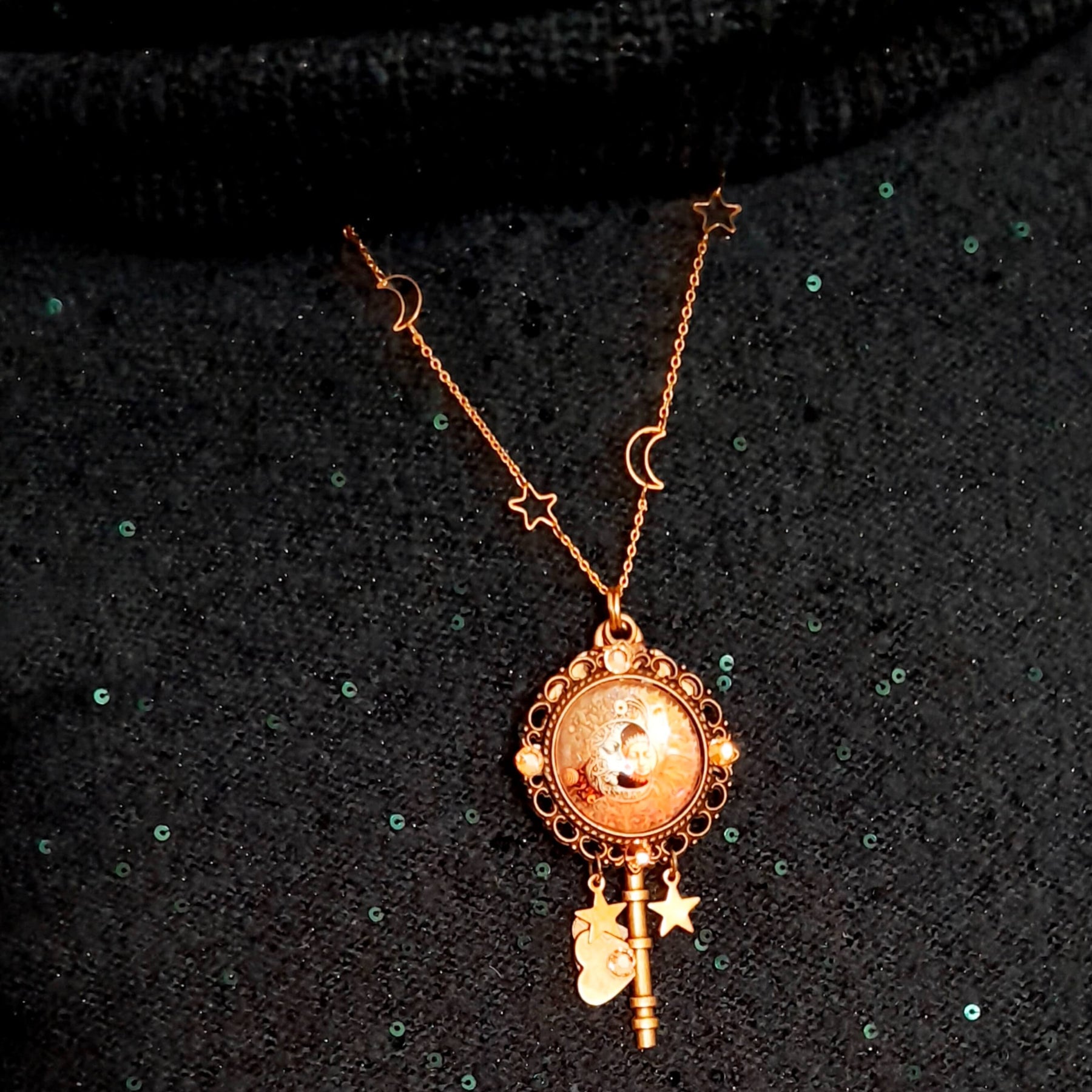 bohemian sun and moon cabochon necklace with stars and gold chain with stars and moons