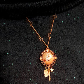 bohemian sun and moon cabochon necklace with stars and gold chain with stars and moons