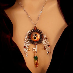 bohemian necklace with sun and moon cabochon, wings, stars, color changing crystal, and swarovski crystals 