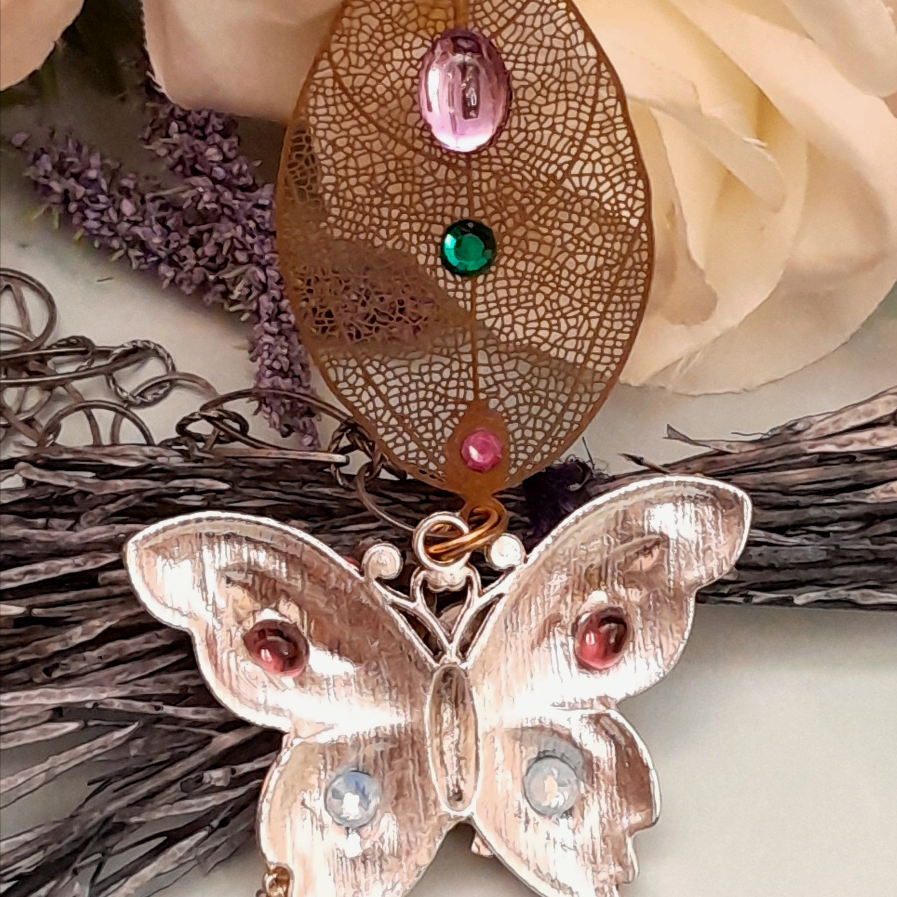 Back detail of handmade magical fantasy rainbow butterfly necklace with steampunk charms, Victorian style vintage style bohemian jewelry swarovksi crystals