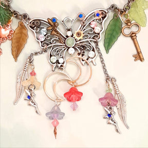 Handmade fantasy butterfly necklace with feather charms, dancing fairies, and rainbow Swarovski crystals, bohemian Victorian style vintage style statement piece
