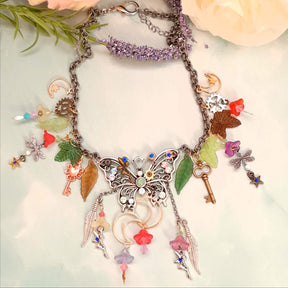 Handmade magical fantasy silver filigree butterfly necklace with rainbow Swarovski crystals and fairy charm, bohemian Victorian style vintage style jewelry