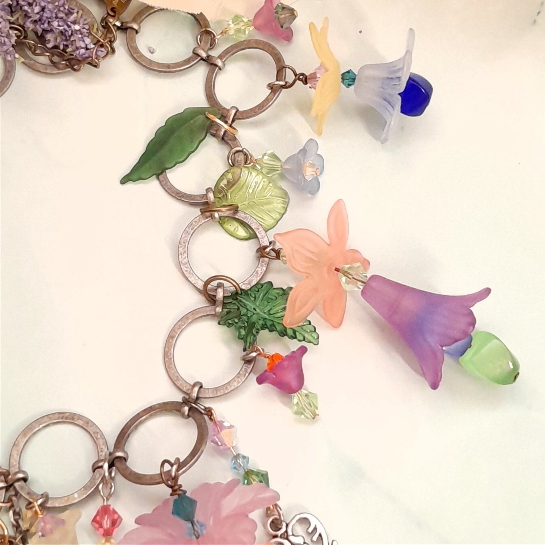 Magical fantasy boho necklace handmade with colorful Swarovski crystal flowers and nature-inspired charms, Victorian style vintage style