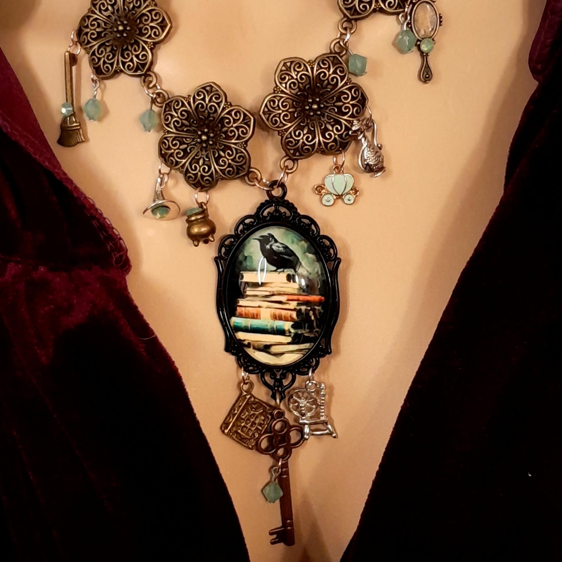 crow necklace fairytale  motifs witch hat room cauldron spinning wheel key