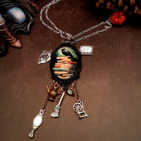fairytale necklace with book mirror spinning wheel crest magic lamp witch hat broom and crow on books