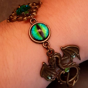 green druzy crystal bracelet with green dragon eyes and brass dragons swarovski green crystals and flower clasp