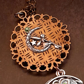 Moon sun cabochon necklace with a double sided owl and green swarovski crystals