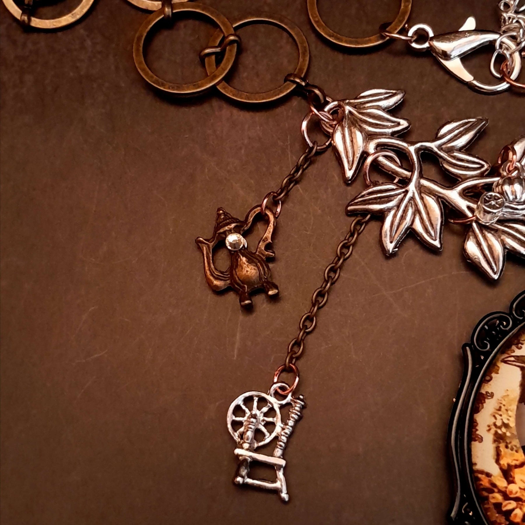 fairytale crow necklace witch hat spinning wheel cauldron mirror broom pumpkin carraige magic lamp