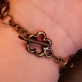 green druzy crystal bracelet with green dragon eyes and brass dragons swarovski green crystals and flower clasp