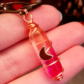bird earrings with dangling flower and glass drops that change color from yellow to pink. wire wrapped with a moon and star