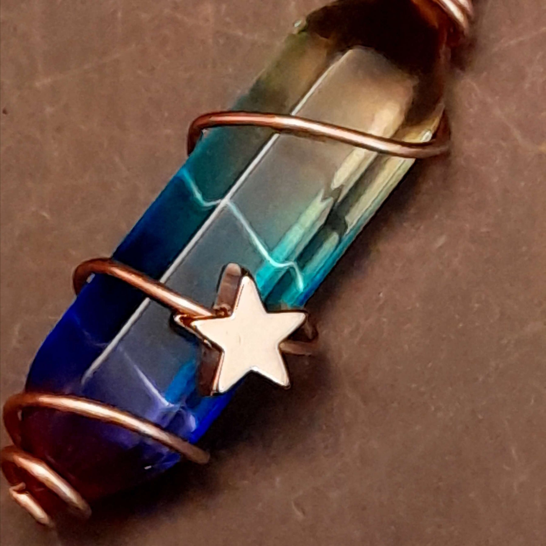 gold moon and star bird cage earrings with blue and purple color changing drop crystals 