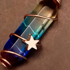 gold moon and star bird cage earrings with blue and purple color changing drop crystals 