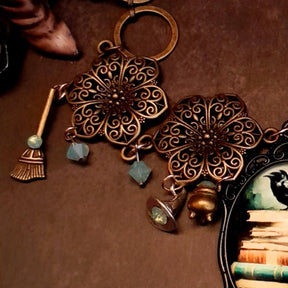 crow necklace fairytale  motifs witch hat room cauldron spinning wheel key