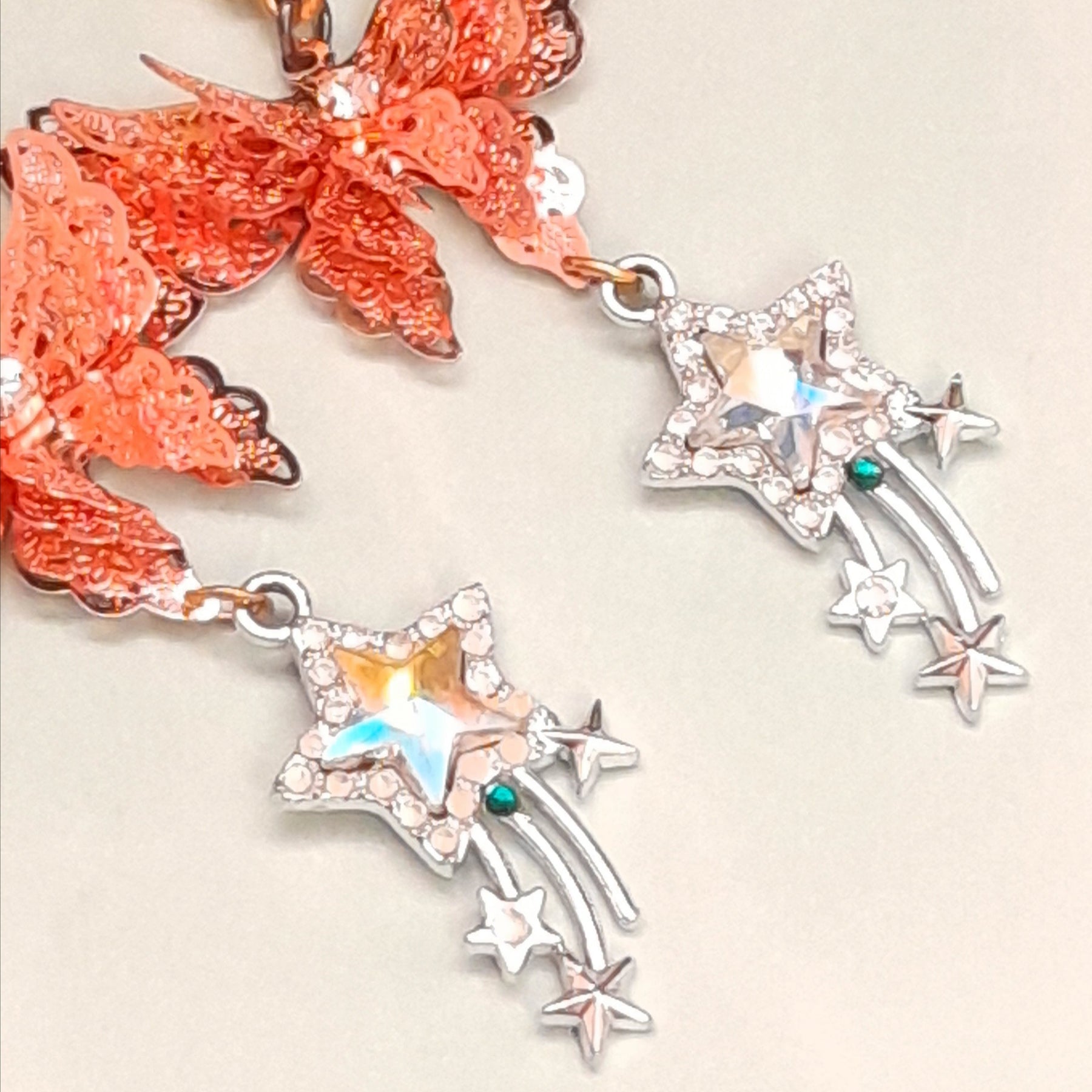 Green Swarovski crystal rose gold butterfly earrings close-up Victorian style vintage style