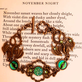 green druzy crystal bracelet with green dragon eyes and brass dragons swarovski green crystals and flower clasp