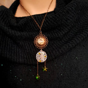 Moon sun cabochon necklace with a double sided owl and green swarovski crystals