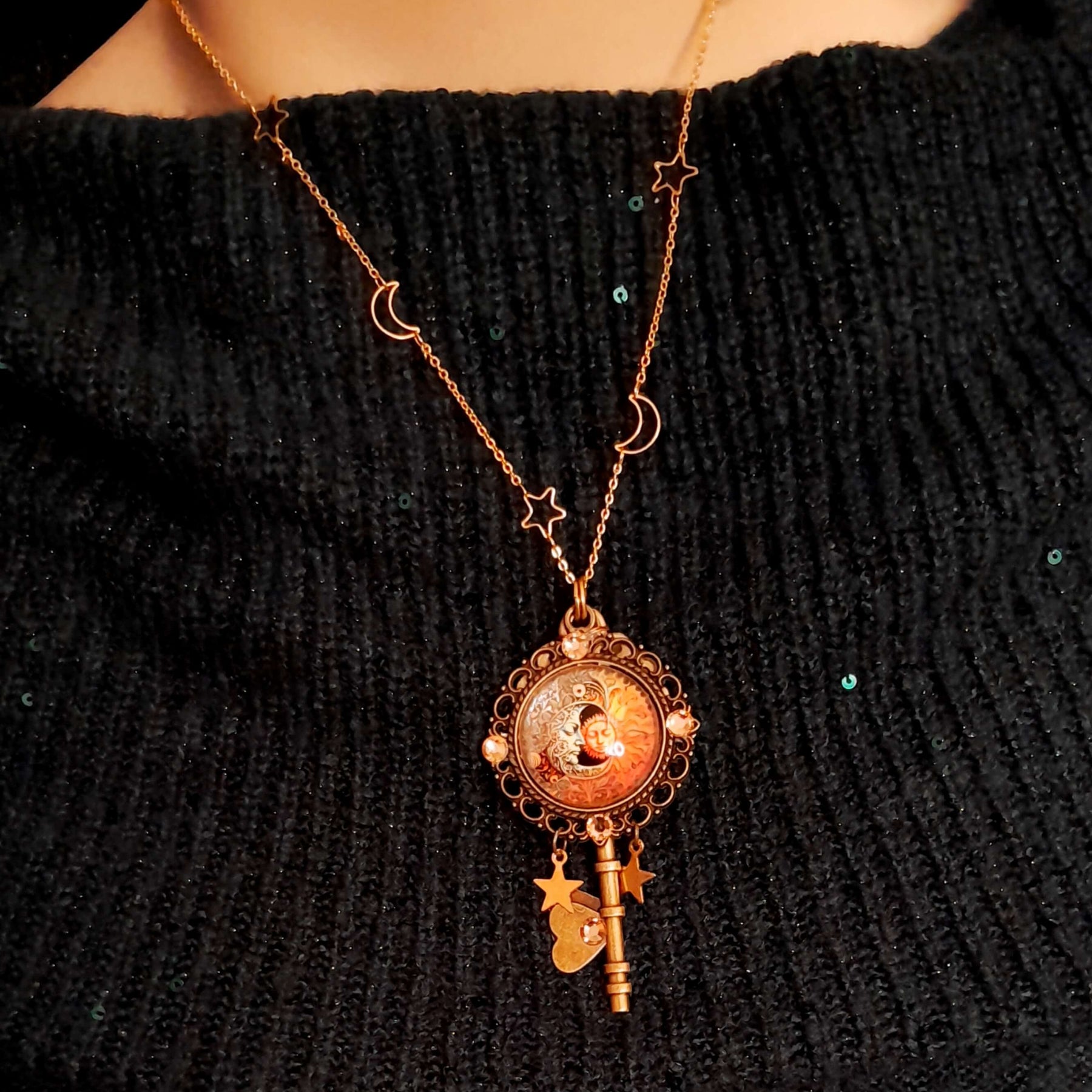 bohemian sun and moon cabochon necklace with stars and gold chain with stars and moons