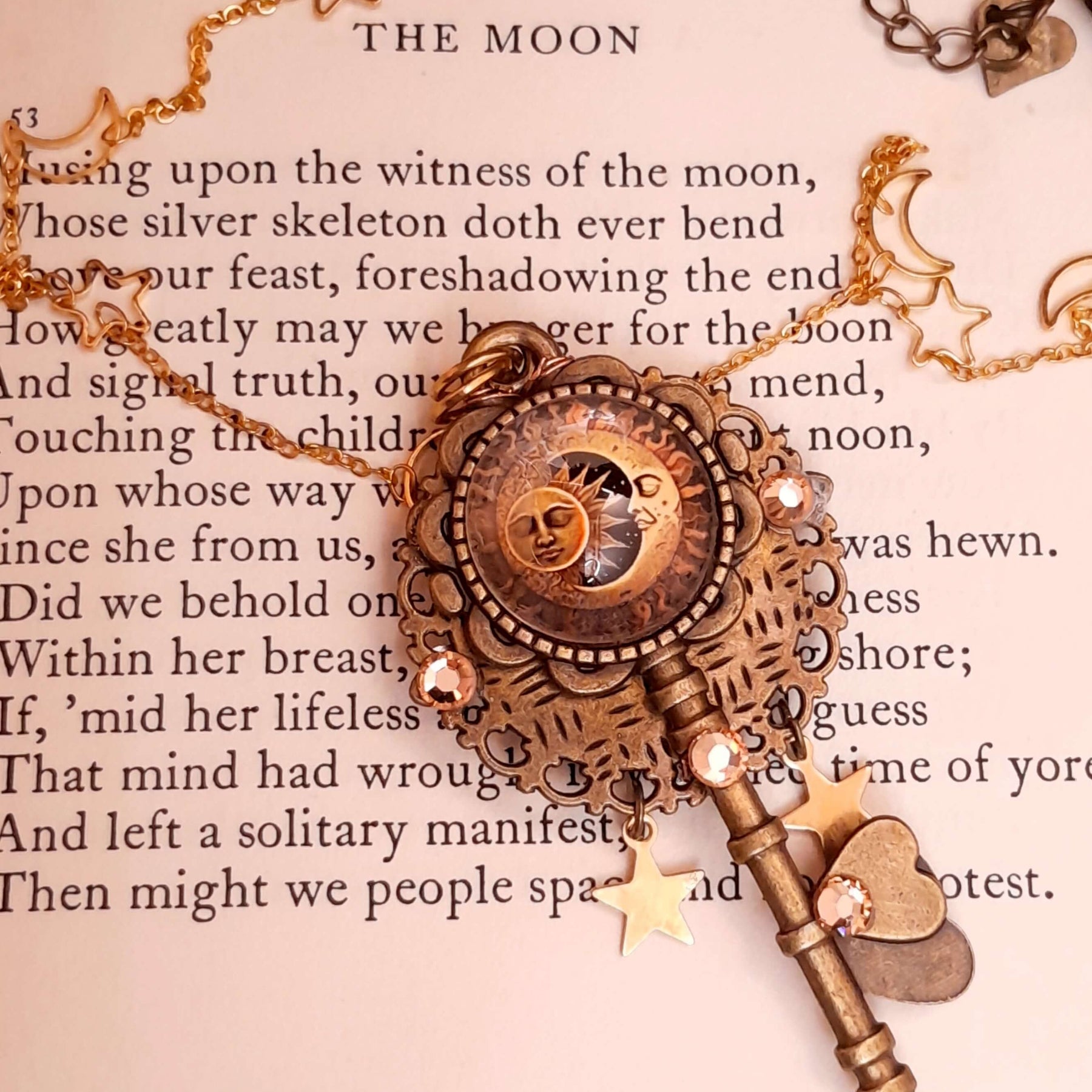 bohemian sun and moon cabochon necklace with stars and gold chain with stars and moons