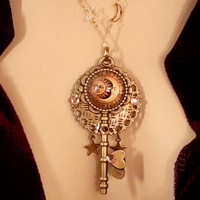 bohemian sun and moon cabochon necklace with stars and gold chain with stars and moons