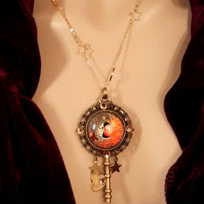 bohemian sun and moon cabochon necklace with stars and gold chain with stars and moons