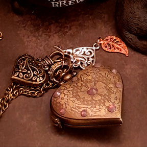 Full length view of handmade magical heart pocket watch necklace with lavender purple Swarovski crystals, Victorian vintage fantasy style jewelry