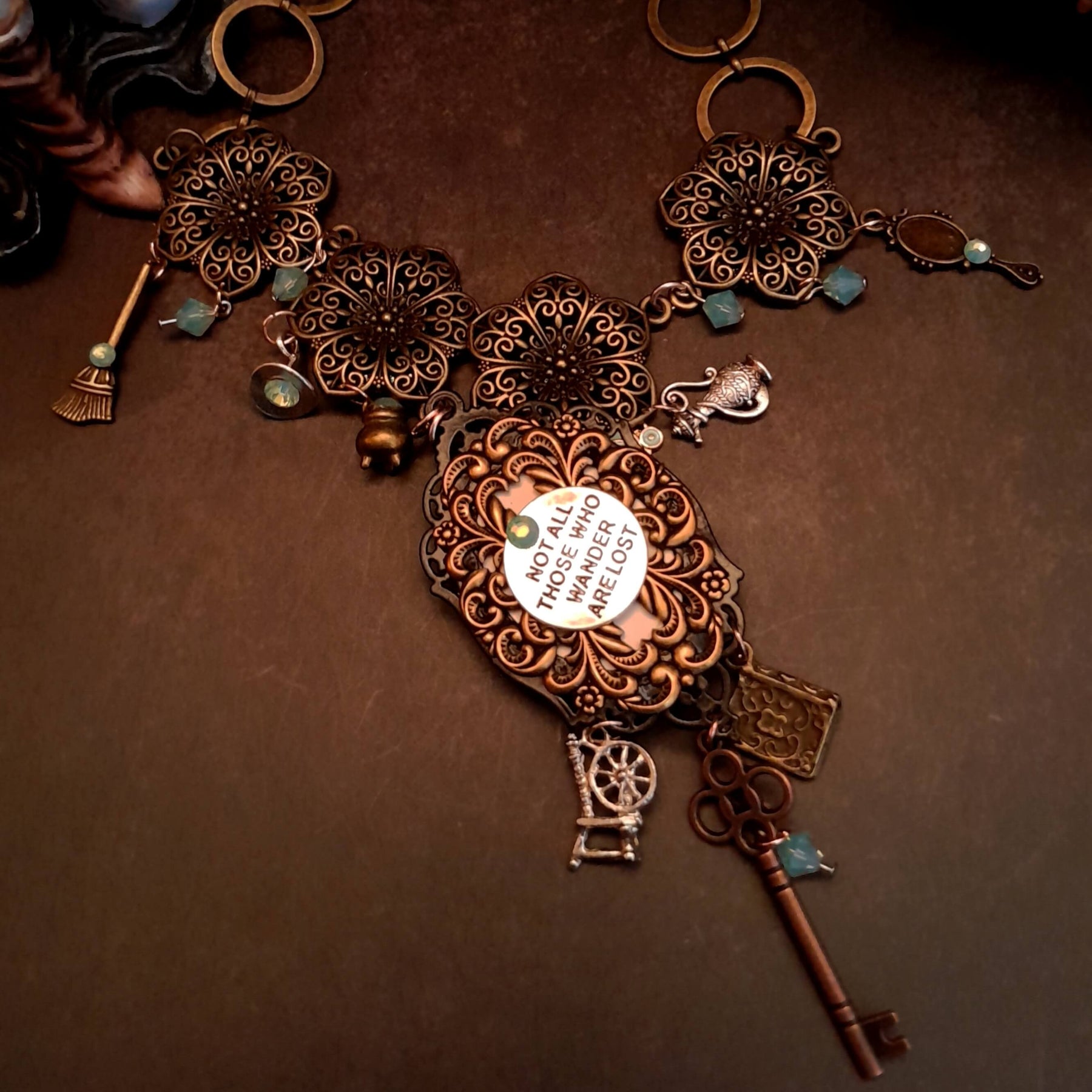 crow necklace fairytale  motifs witch hat room cauldron spinning wheel key