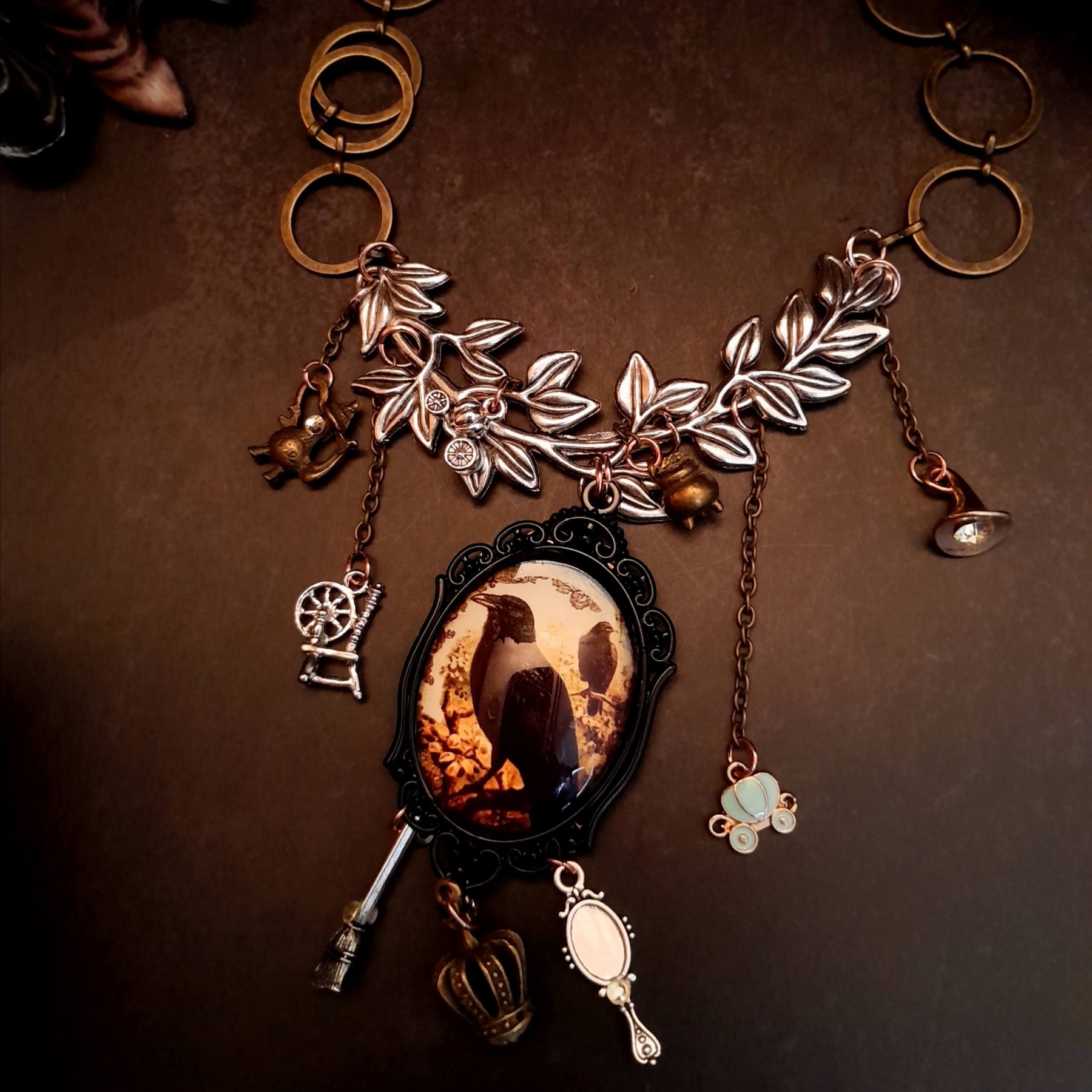 fairytale crow necklace witch hat spinning wheel cauldron mirror broom pumpkin carraige magic lamp