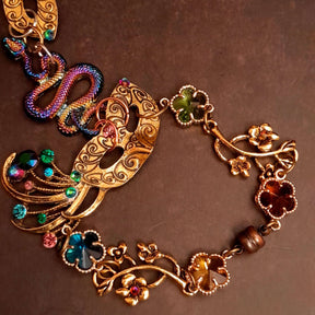 slave bracelet hand chain with adjustable flower ring and masks. colcorful flowers and vines a serpent snake and swarovski crystals