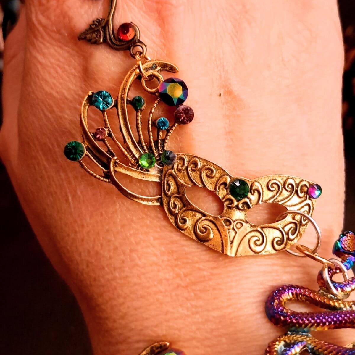 slave bracelet hand chain with adjustable flower ring and masks. colcorful flowers and vines a serpent snake and swarovski crystals