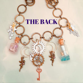 Back view of handmade magical mermaid necklace showing silver sun gear, brass gear and dangling skeleton key - Victorian style vintage style fantasy jewelry by Rachel Flam Design