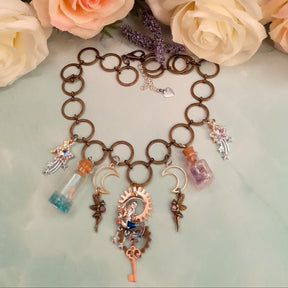 
Handmade magical mermaid necklace with rose gold sun gear, silver crescent moon, crystal stars and skeleton key - Victorian style vintage style fantasy jewelry by Rachel Flam Design

