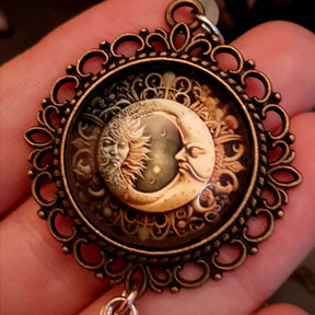 Moon sun cabochon necklace with a double sided owl and green swarovski crystals