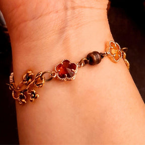 slave bracelet hand chain with adjustable flower ring and masks. colcorful flowers and vines a serpent snake and swarovski crystals