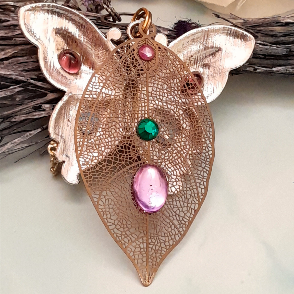 Back view of handmade magical fantasy steampunk butterfly necklace, Victorian style vintage style boho jewelry detail swarovski crystals