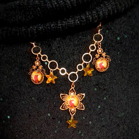 owl necklace with yellow star crystals and yellow brown tones floral settings for owl cabochons