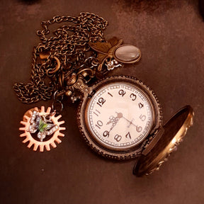 Full length view of handmade magical steampunk butterfly pocket watch necklace with lavender Austrian crystals, vintage Victorian fantasy style