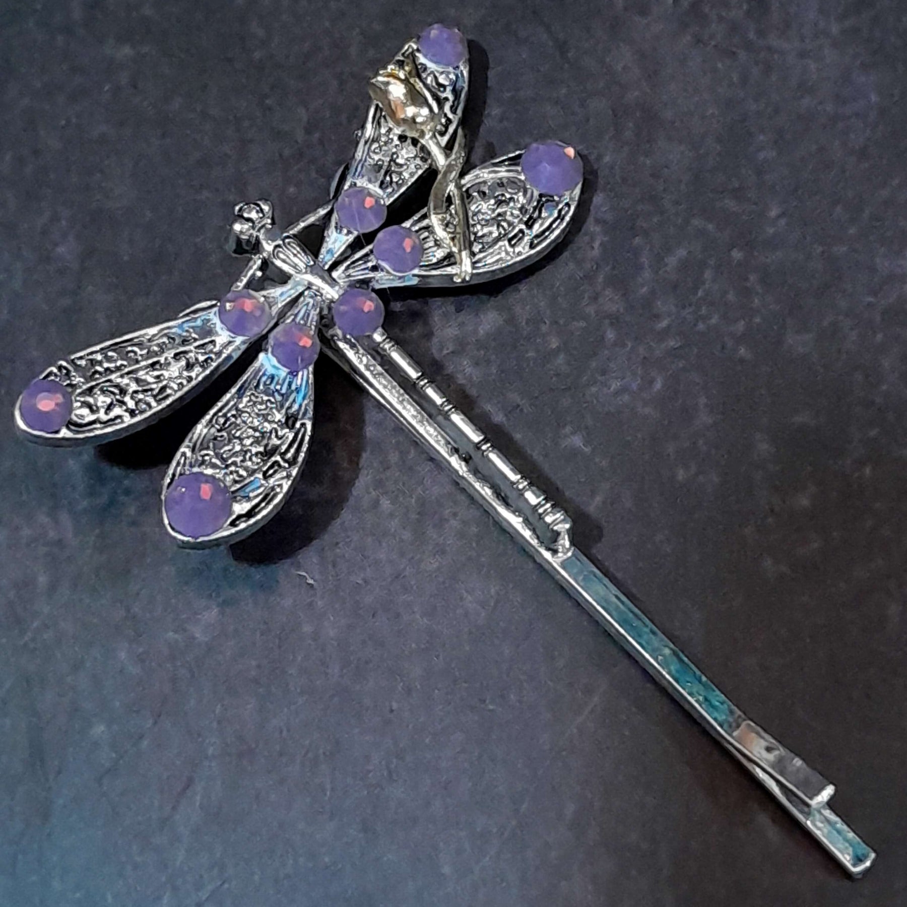 dragonfly hairclip with swarovski amethyst opal purple crystals and a small flower accent