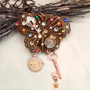 Handmade magical fantasy brass filigree butterfly necklace with rainbow Swarovski crystals and steampunk clock, Victorian style vintage style jewelry

