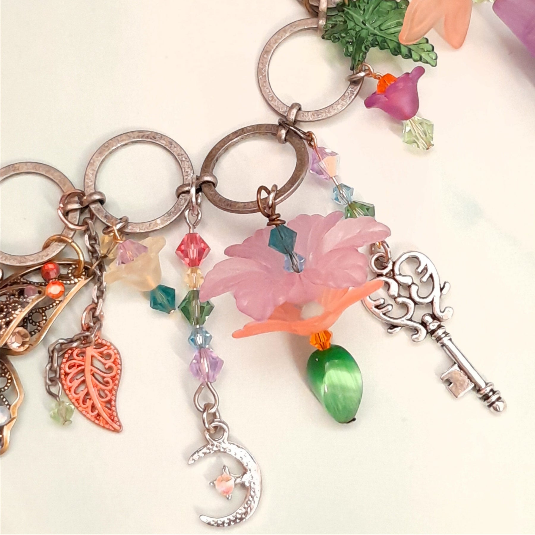 Handmade magical fantasy boho necklace with rainbow flowers, nature charms, and Swarovski crystals, Victorian style vintage style