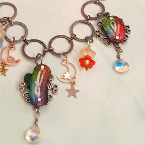 Back view ofhandmade magical fantasy rainbow stone necklace with fairy charms and Swarovski crystals, Victorian style vintage style bohemian jewelry