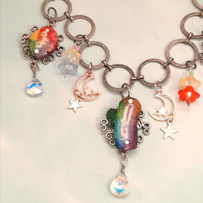 Magical fantasy rainbow stone necklace with floral and celestial pieces